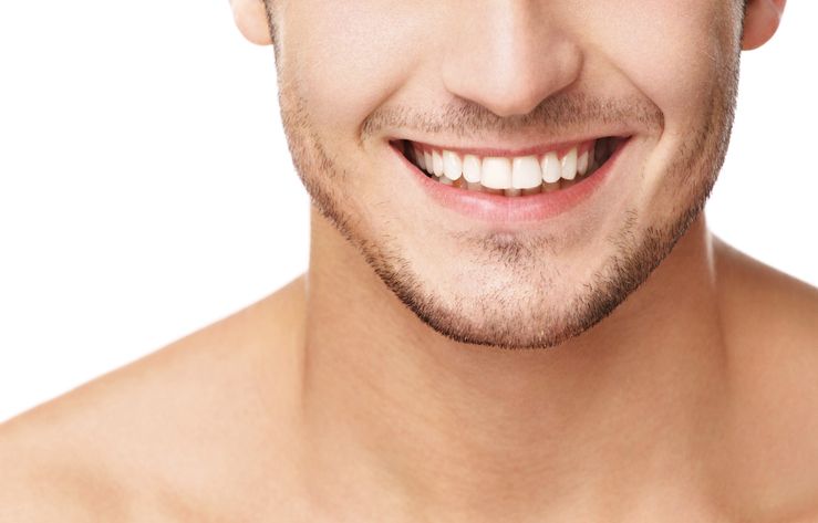 cropped image of a man smiling with bright white smile oral health general dentistry dentist in Raleigh North Carolina